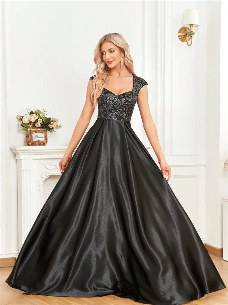 Step into luxury and sophistication with this elegant black evening gown designed for unforgettable formal occasions